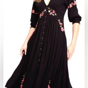 - Free People black midi dress with embroidering.  2 front pockets.  Sz S
